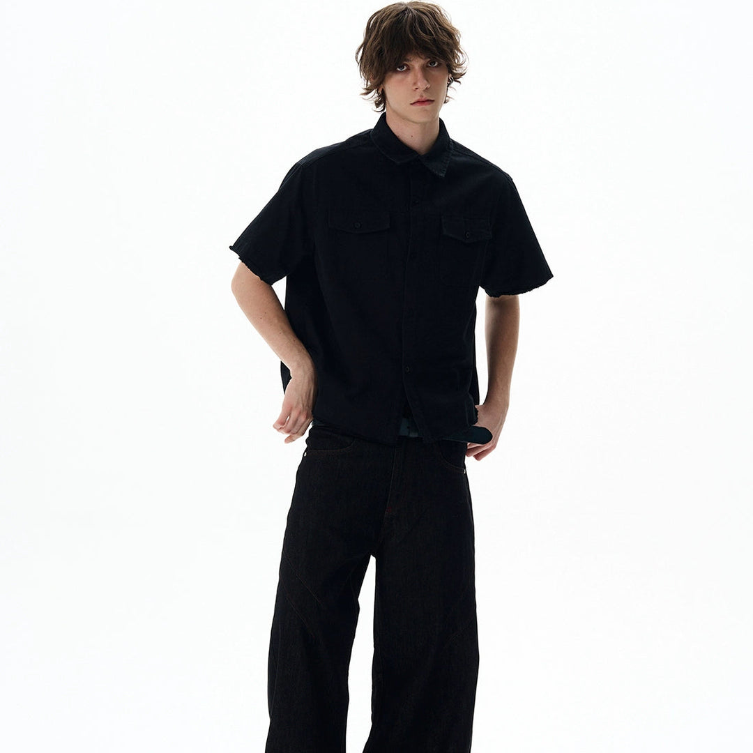 Person wearing a black outfit on a white background